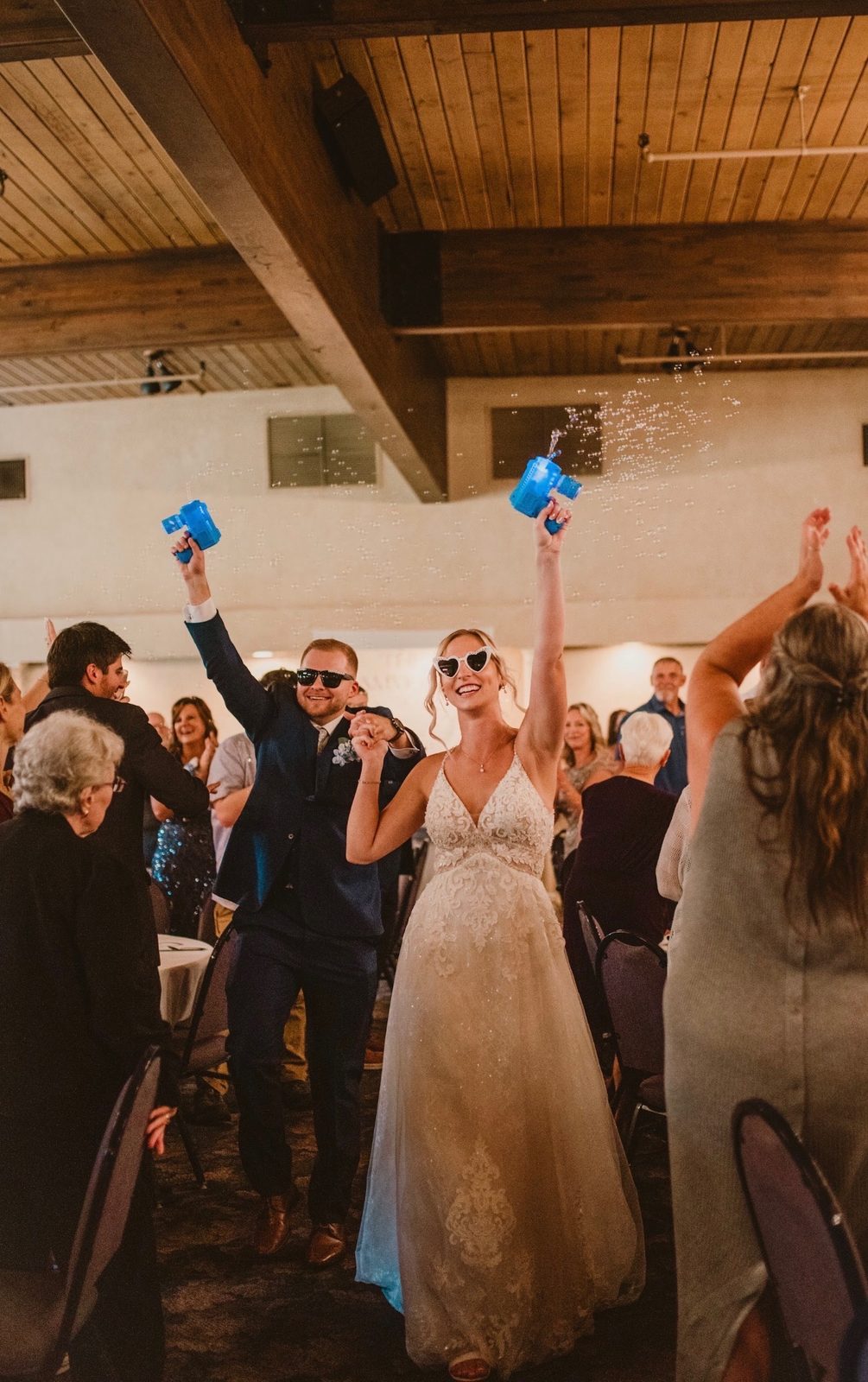 Bride and groom grand entrance with bubbles