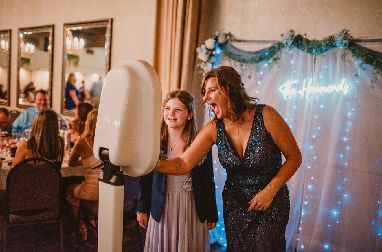 Guests laughing together in the photo booth