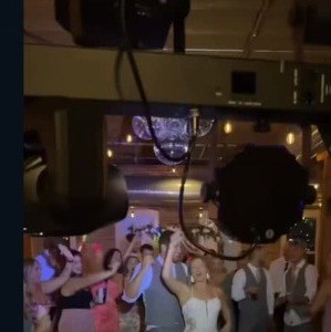 Bride dancing with guests on the dance floor