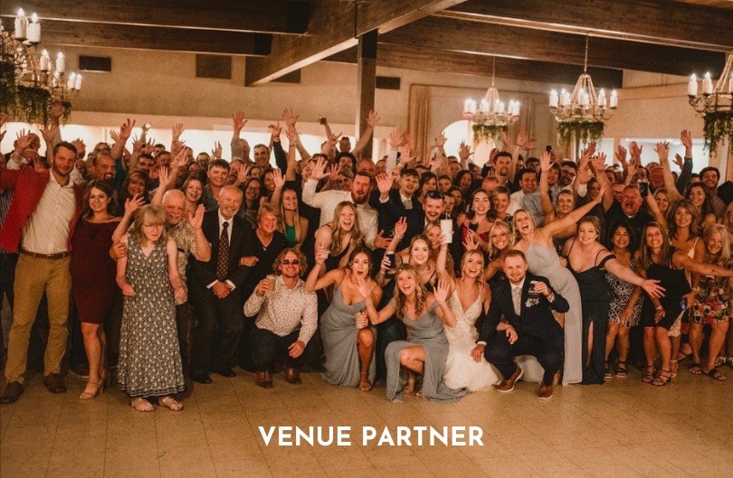 Full dance floor of wedding guests celebrating with 413 Entertainment